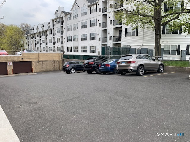 50 Glenbrook Road, Unit 5G Stamford, CT 06902 - Photo 10 of 40 a view of a cars parked in front of a building