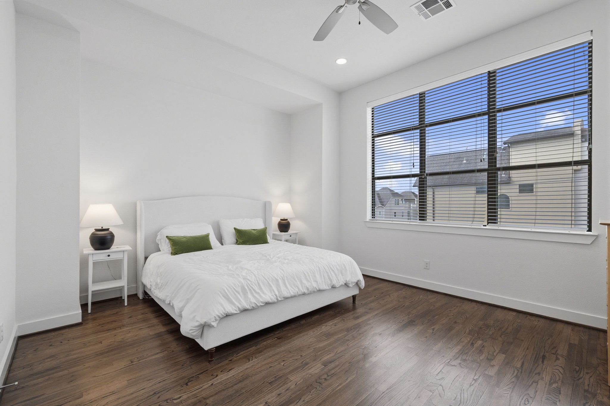 1514 Beall Street Houston, TX 77008 - Photo 24 of 33 Bright secondary bedroom with large window and clean neutral tones