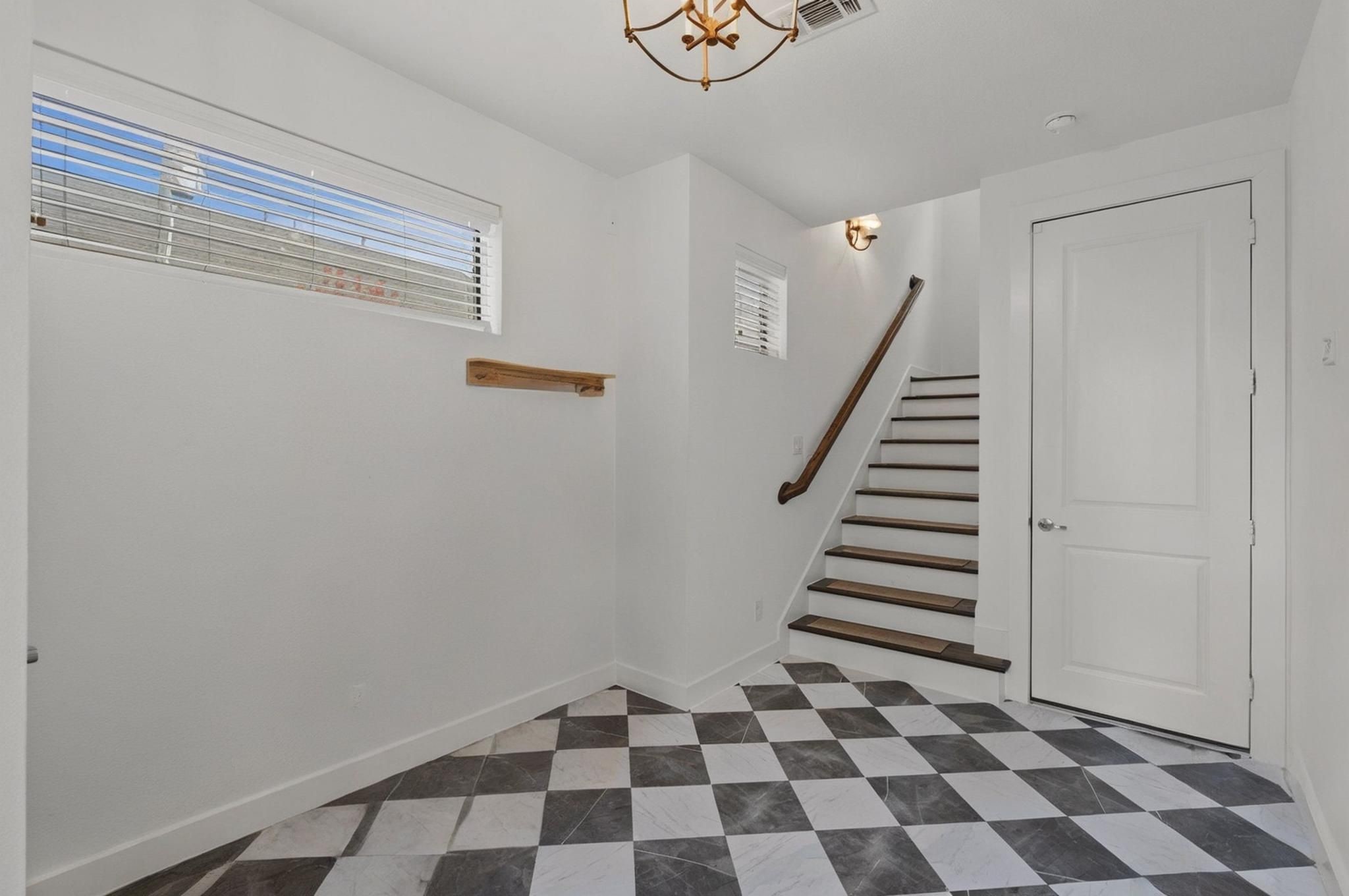 1514 Beall Street Houston, TX 77008 - Photo 4 of 33 Stylish foyer featuring statement flooring and staircase detail (Items Virtually Removed)