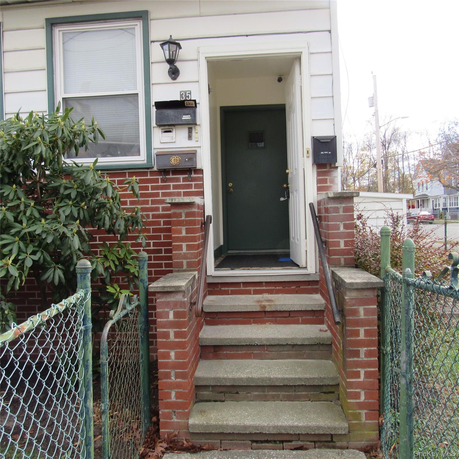35 Taylor Avenue, Unit 2 Poughkeepsie, NY 12601 - Photo 2 of 19 Property entrance featuring brick siding and a gate