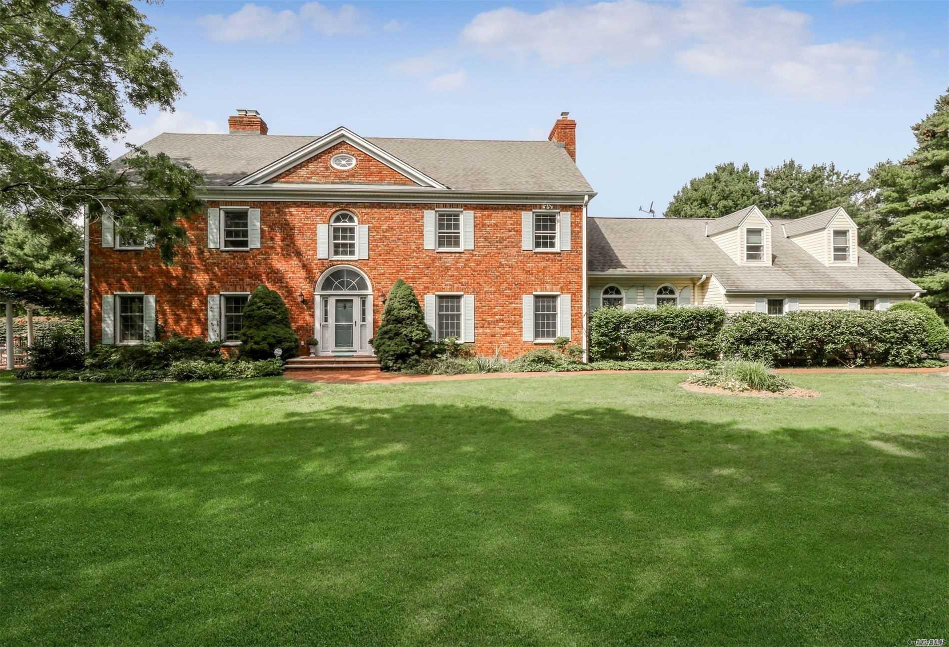 30 Fort Hill Road Huntington, NY 11743 - Photo 1 of 1 a front view of a house with a yard