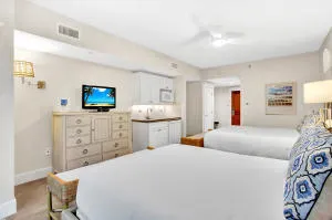 a bedroom with a bed and a view of kitchen