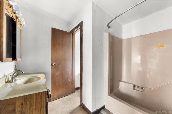 a bathroom with a sink and mirror