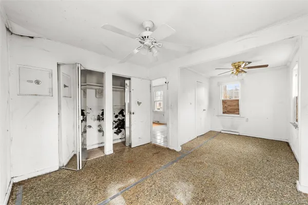 a kitchen with a sink a refrigerator and cabinets