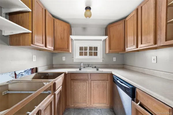 a kitchen with cabinets and refrigerator