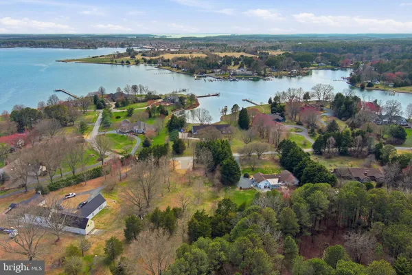 a view of a lake with lots of residential buildings