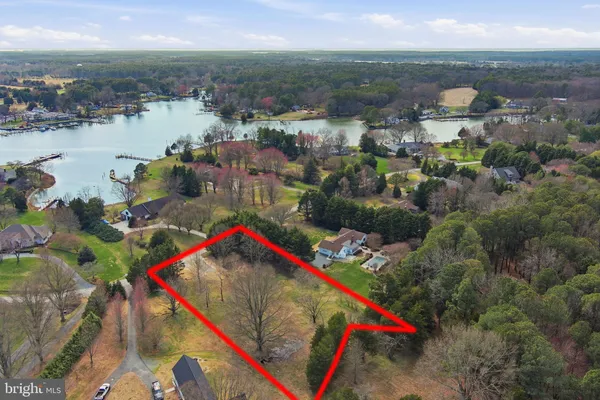 a view of a garden with a building in the background