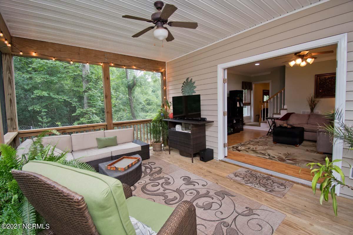 106 Shady Path Cedar Point, NC 28584 - Photo 14 of 75 View into Living Room from Screened Porch