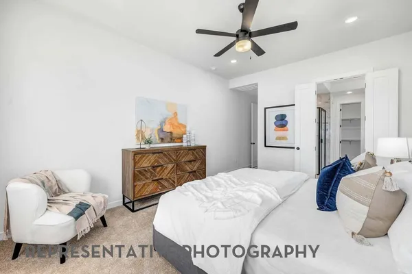 a bedroom with a bed and couch