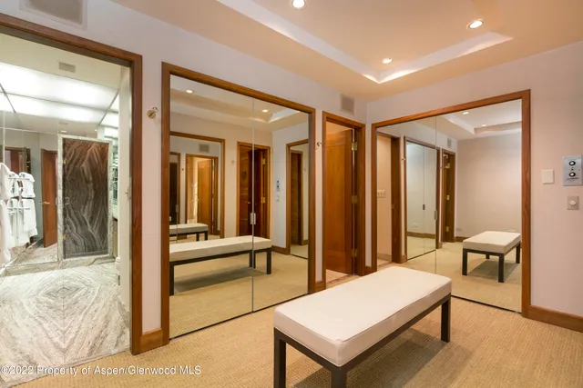 a room with pool table and glass door