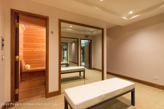 a bedroom with a bed and a lamp