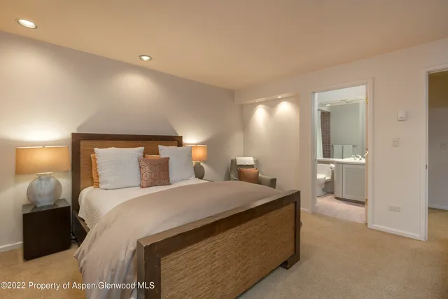 a bedroom with bed and window