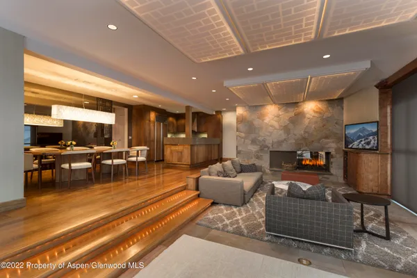 a living room with furniture and a table