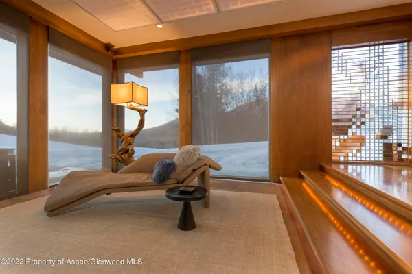a view of swimming pool with seating area