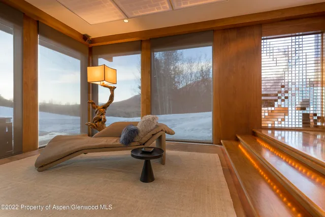 a view of swimming pool with seating area