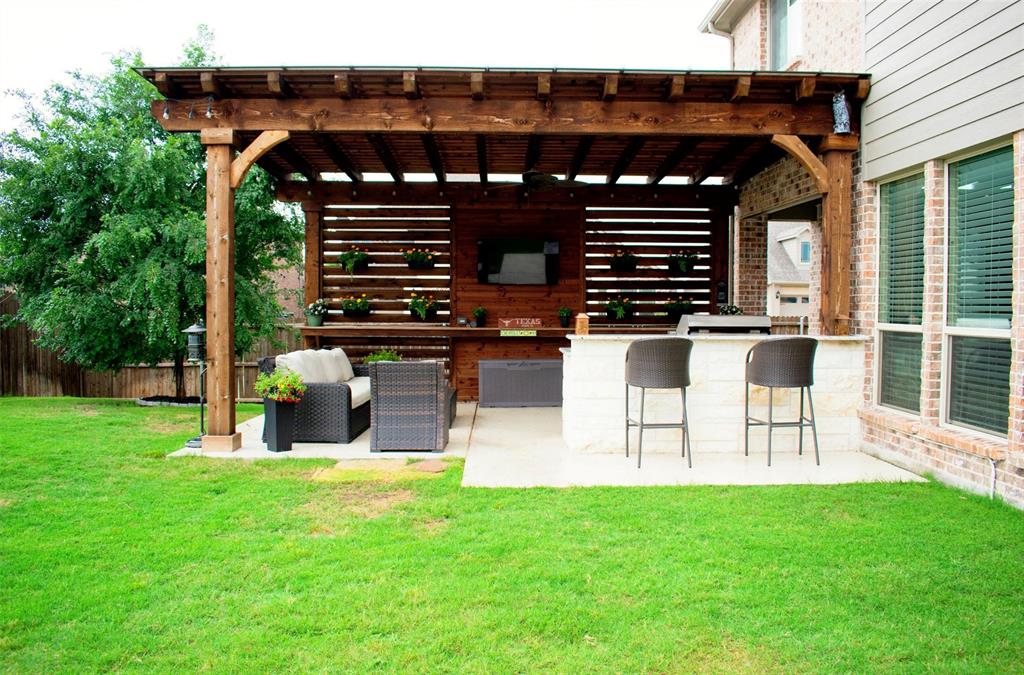 2104 Vista Ridge Road Melissa, TX 75454 - Photo 31 of 40 a view of a porch with chairs and a yard