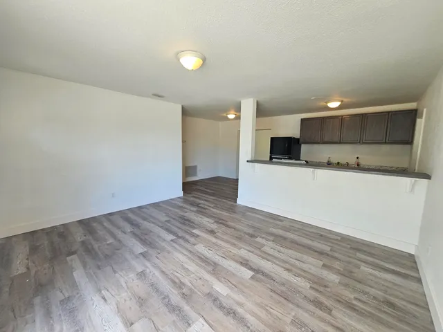 a view of a kitchen with a sink and a microwave