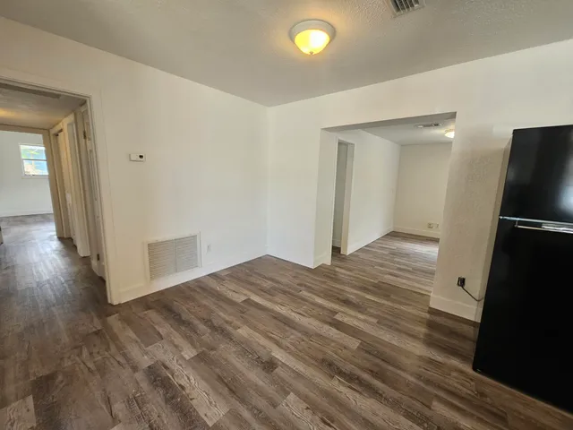 a view of a livingroom with wooden floor