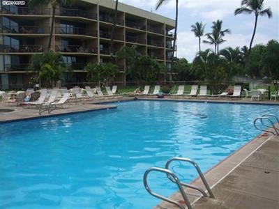 1032 South Kihei Road, Unit A203 Kihei, HI 96753 - Photo 13 of 13 a view of a swimming pool with outdoor seating and plants