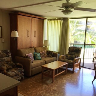 1032 South Kihei Road, Unit A203 Kihei, HI 96753 - Photo 3 of 13 a living room with furniture and a large window