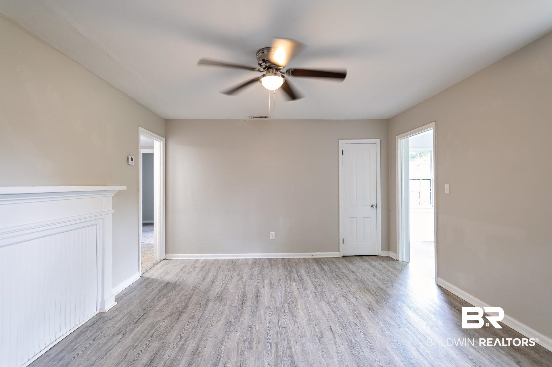 1869 Mott Drive West Mobile, AL 36617 - Photo 6 of 34 Empty room featuring baseboards, visible vents, ceiling fan, and wood finished floors