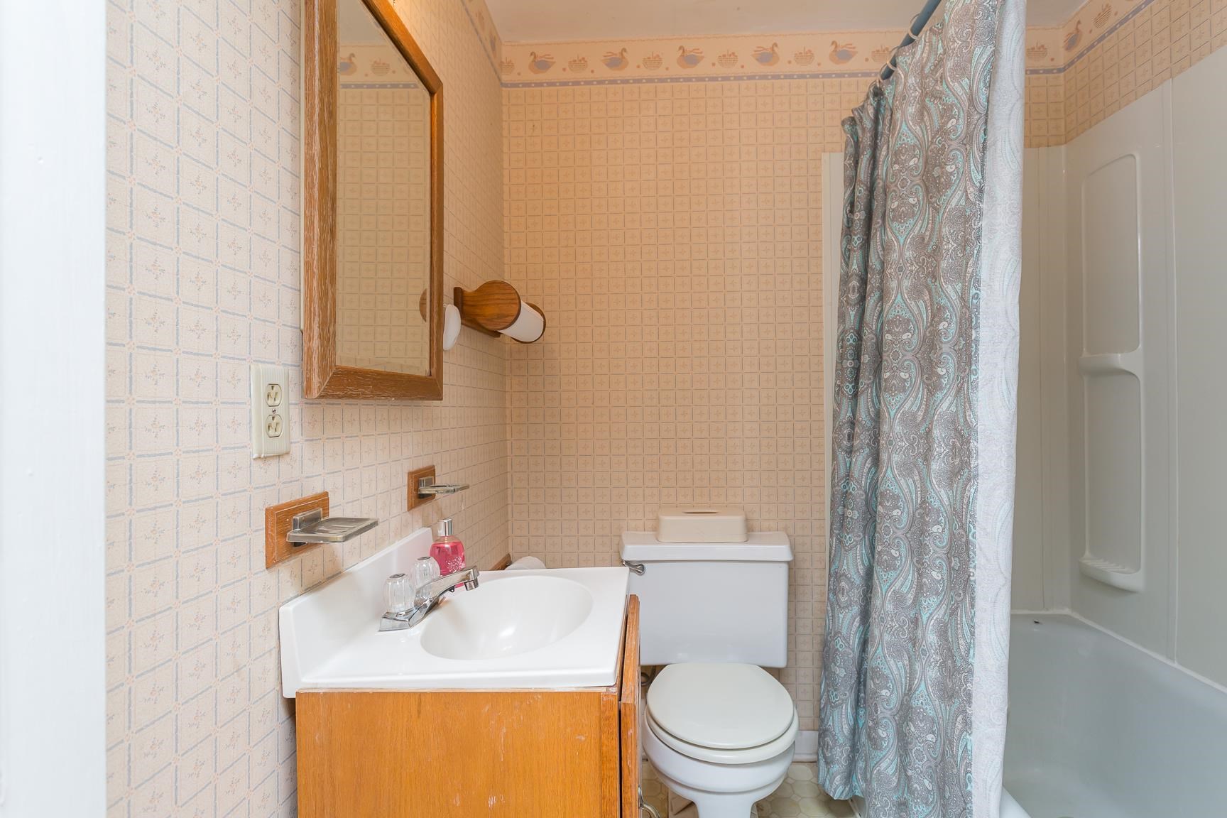 572 Battlefield Road New Hope, VA 24437 - Photo 17 of 39 a bathroom with a sink toilet and shower