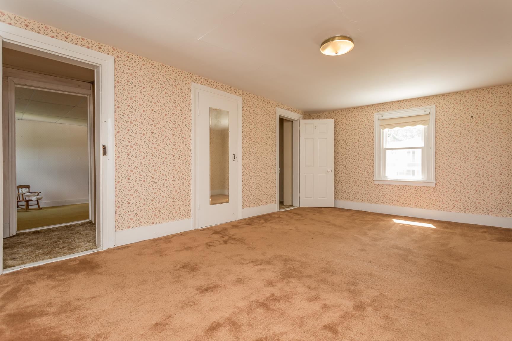572 Battlefield Road New Hope, VA 24437 - Photo 21 of 39 an empty room with windows and closet