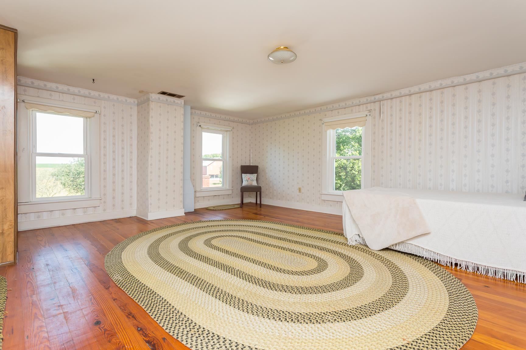 572 Battlefield Road New Hope, VA 24437 - Photo 25 of 39 a spacious bedroom with a bed and window