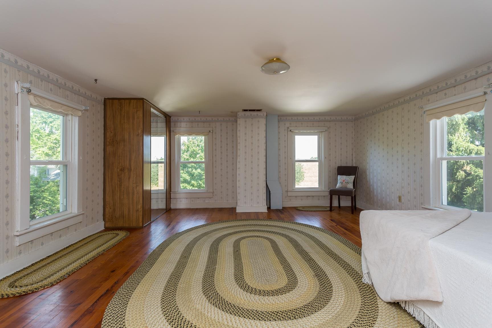 572 Battlefield Road New Hope, VA 24437 - Photo 26 of 39 a spacious bedroom with a bed and window
