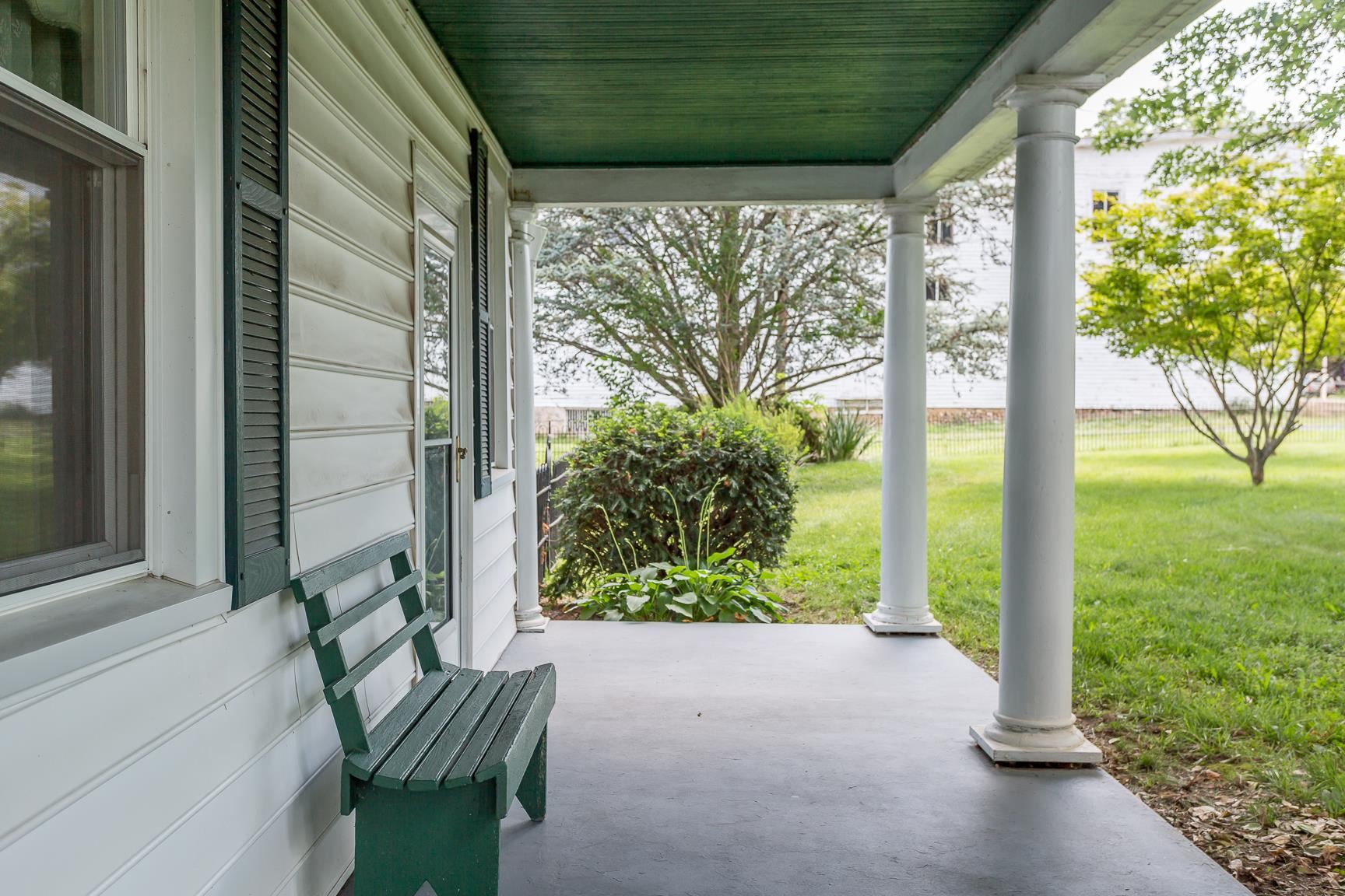 572 Battlefield Road New Hope, VA 24437 - Photo 38 of 39 a view of a porch with chairs and a yard