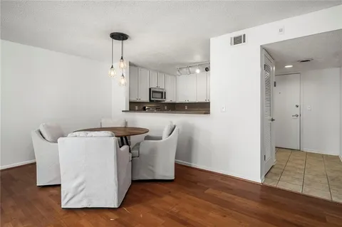 a kitchen with stainless steel appliances a refrigerator and a stove