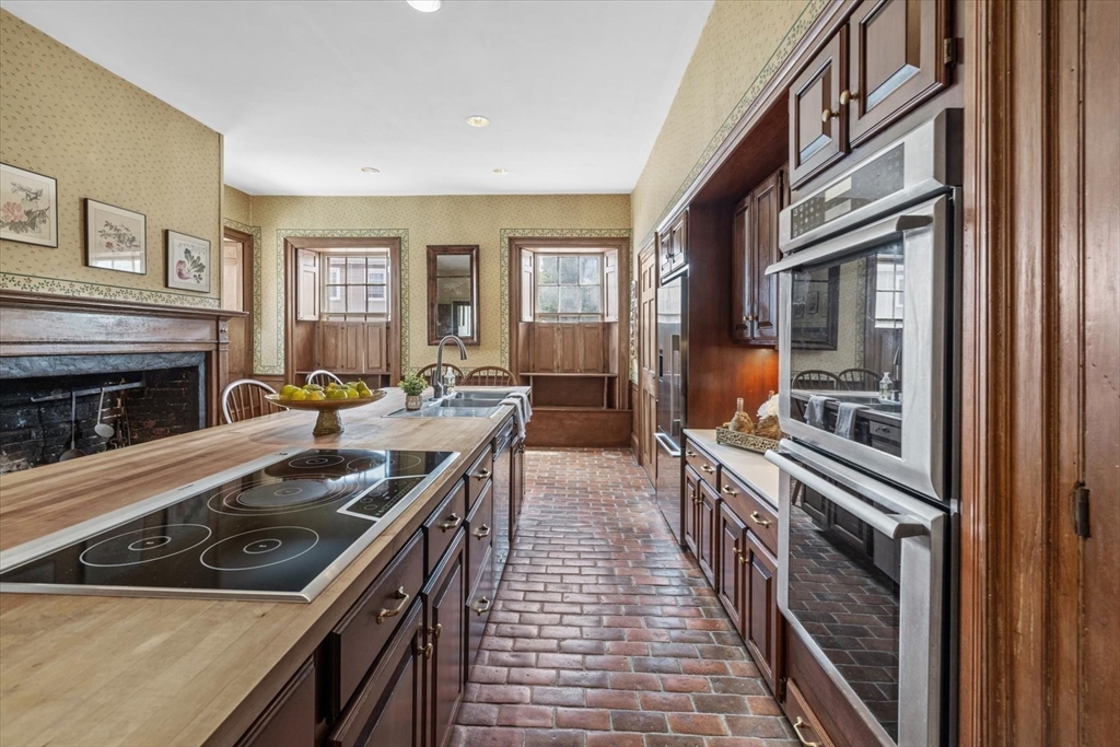 166 High Street Danvers, MA 01923 - Photo 17 of 42 a kitchen that has a sink and a stove