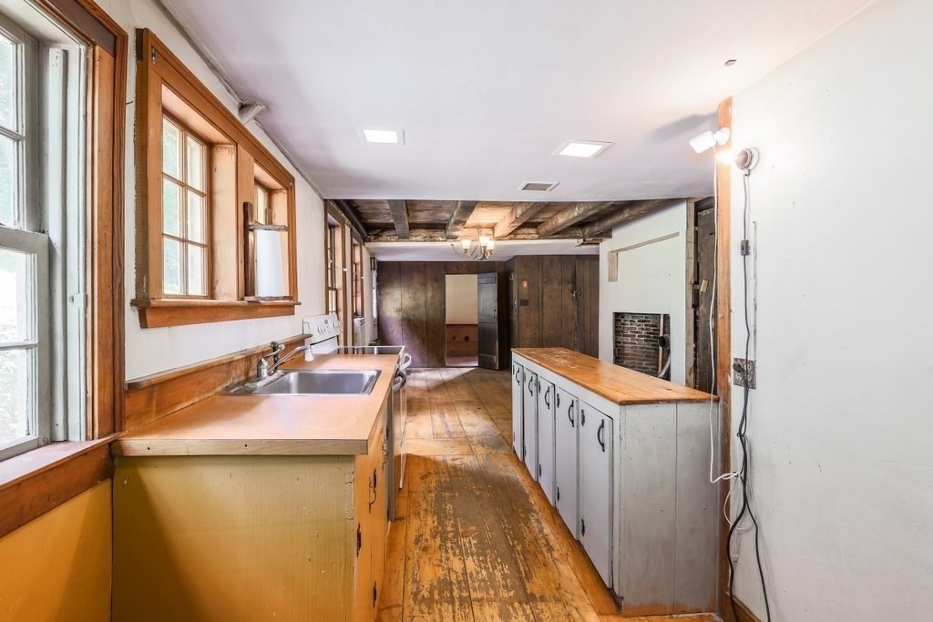 116 Spring Street Hull, MA 02045 - Photo 16 of 37 a view of a bathroom with sink and mirror