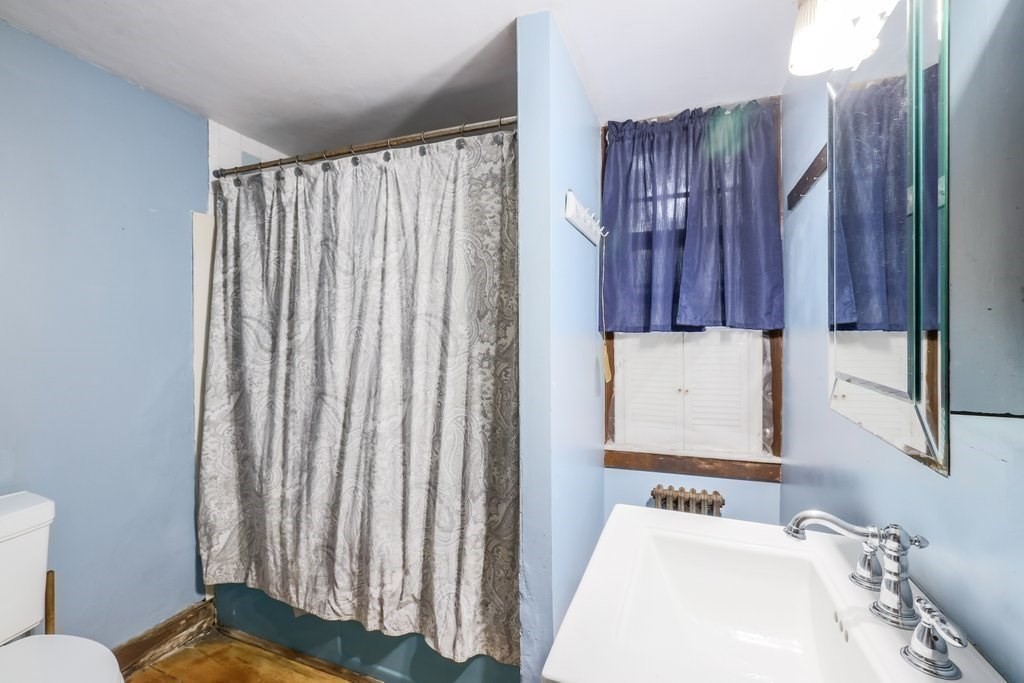 116 Spring Street Hull, MA 02045 - Photo 19 of 37 a bathroom with a sink and a mirror