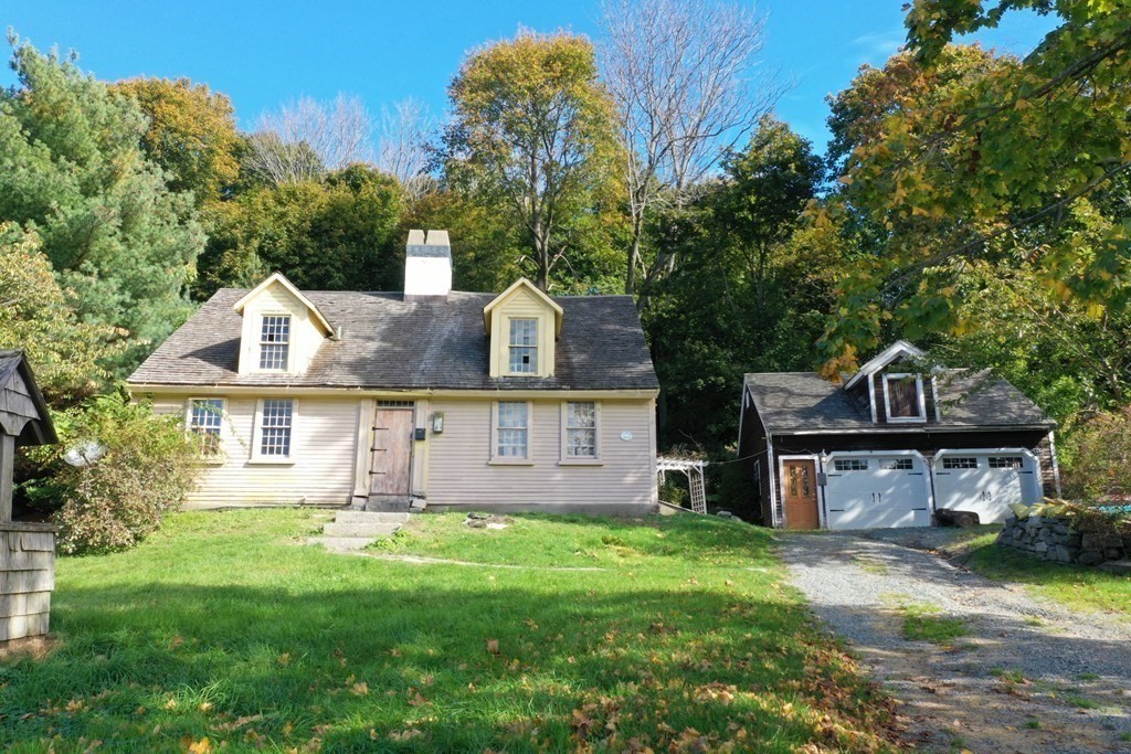 116 Spring Street Hull, MA 02045 - Photo 28 of 37 a front view of a house with a garden and plants