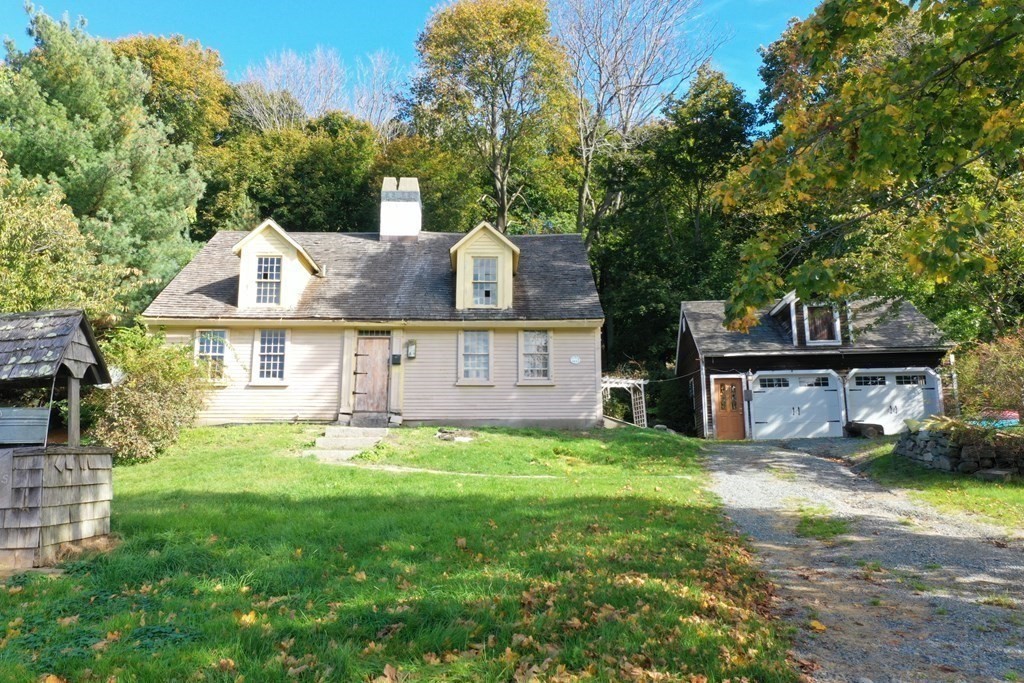 116 Spring Street Hull, MA 02045 - Photo 29 of 37 a front view of a house with a yard and garage