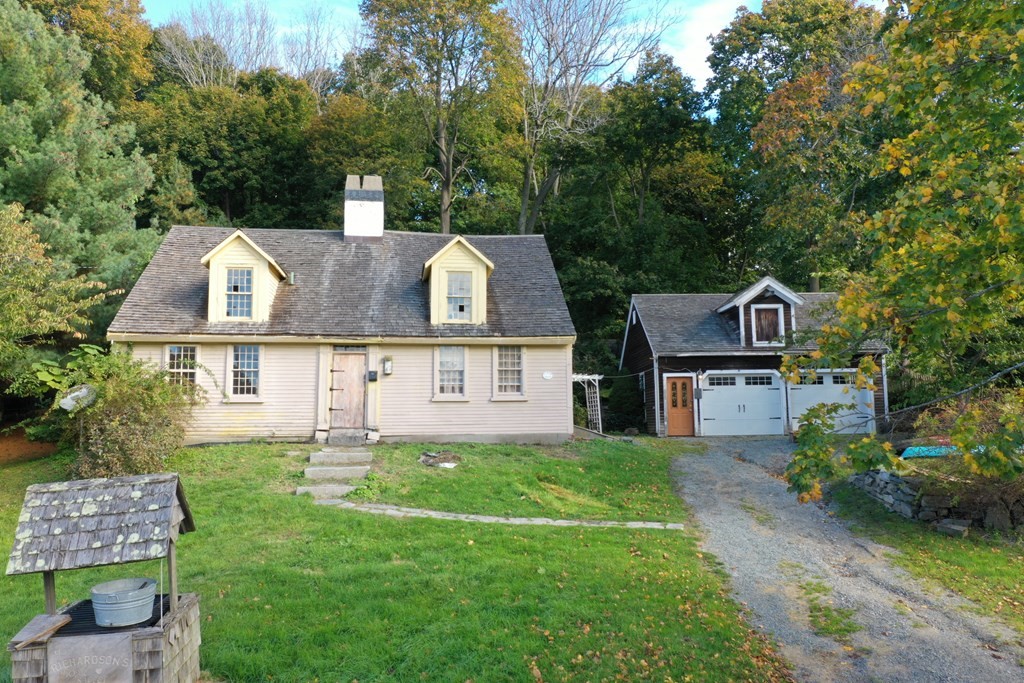 116 Spring Street Hull, MA 02045 - Photo 37 of 37 aerial view of a house with a big yard and large trees