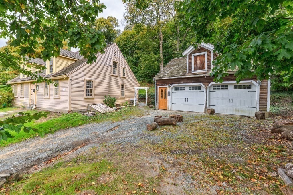 116 Spring Street Hull, MA 02045 - Photo 7 of 37 a view of a house with a yard and large tree