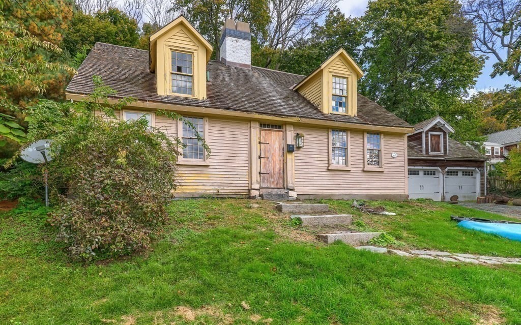 116 Spring Street Hull, MA 02045 - Photo 8 of 37 a front view of a house with a yard