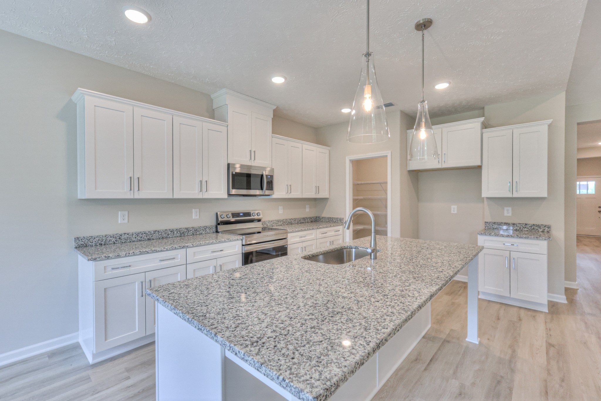18 North Fork Branch Road Normandy, TN 37360 - Photo 14 of 28 a kitchen with stainless steel appliances granite countertop a sink stove and refrigerator