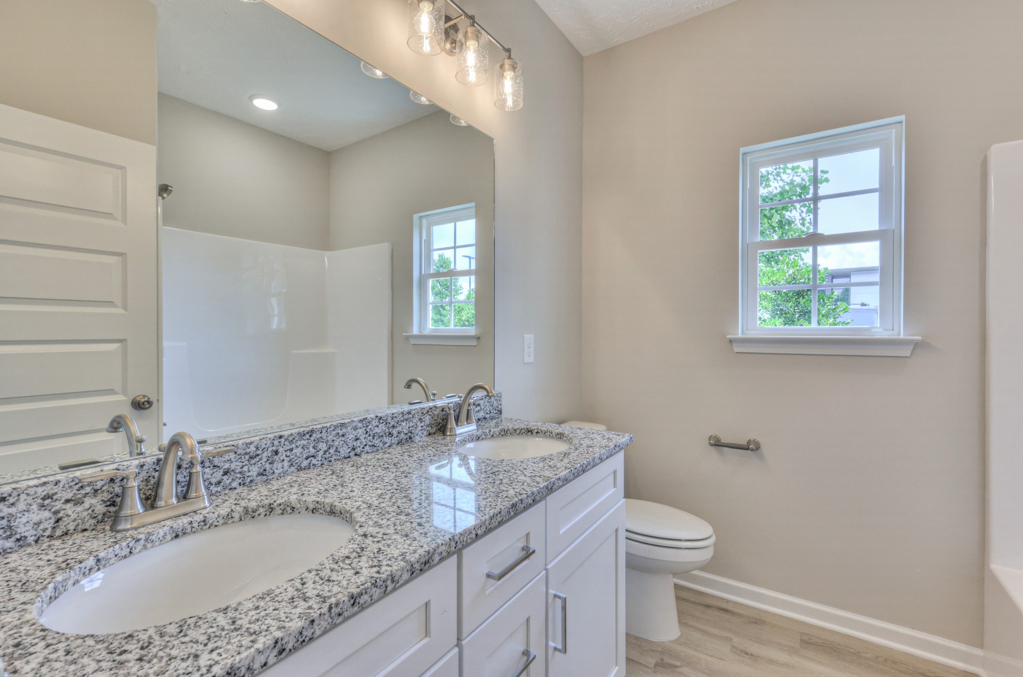 18 North Fork Branch Road Normandy, TN 37360 - Photo 24 of 28 a bathroom with a granite countertop sink a toilet and a mirror