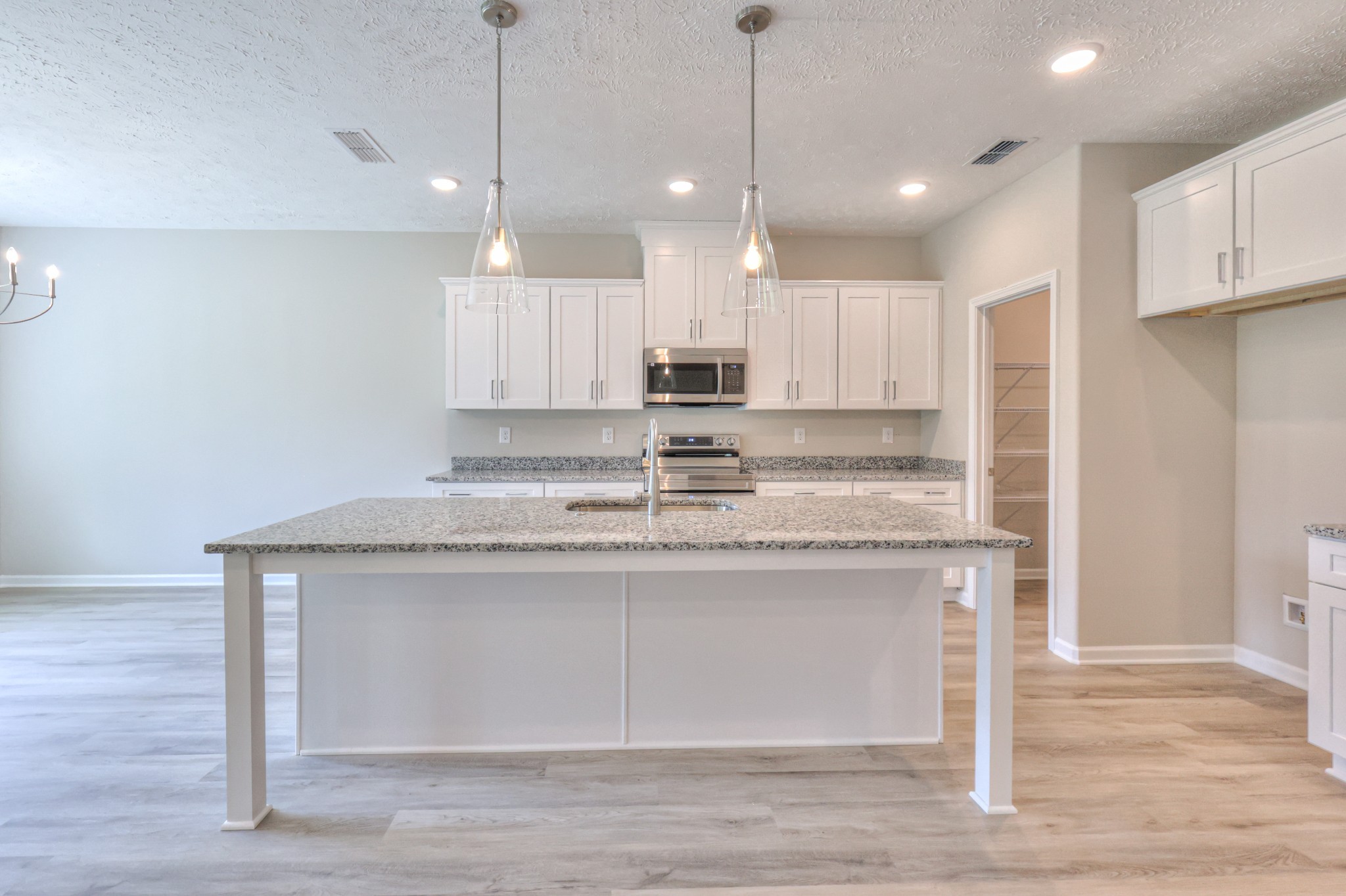 18 North Fork Branch Road Normandy, TN 37360 - Photo 8 of 28 a view of kitchen with granite countertop cabinets counter top space and stainless steel appliances