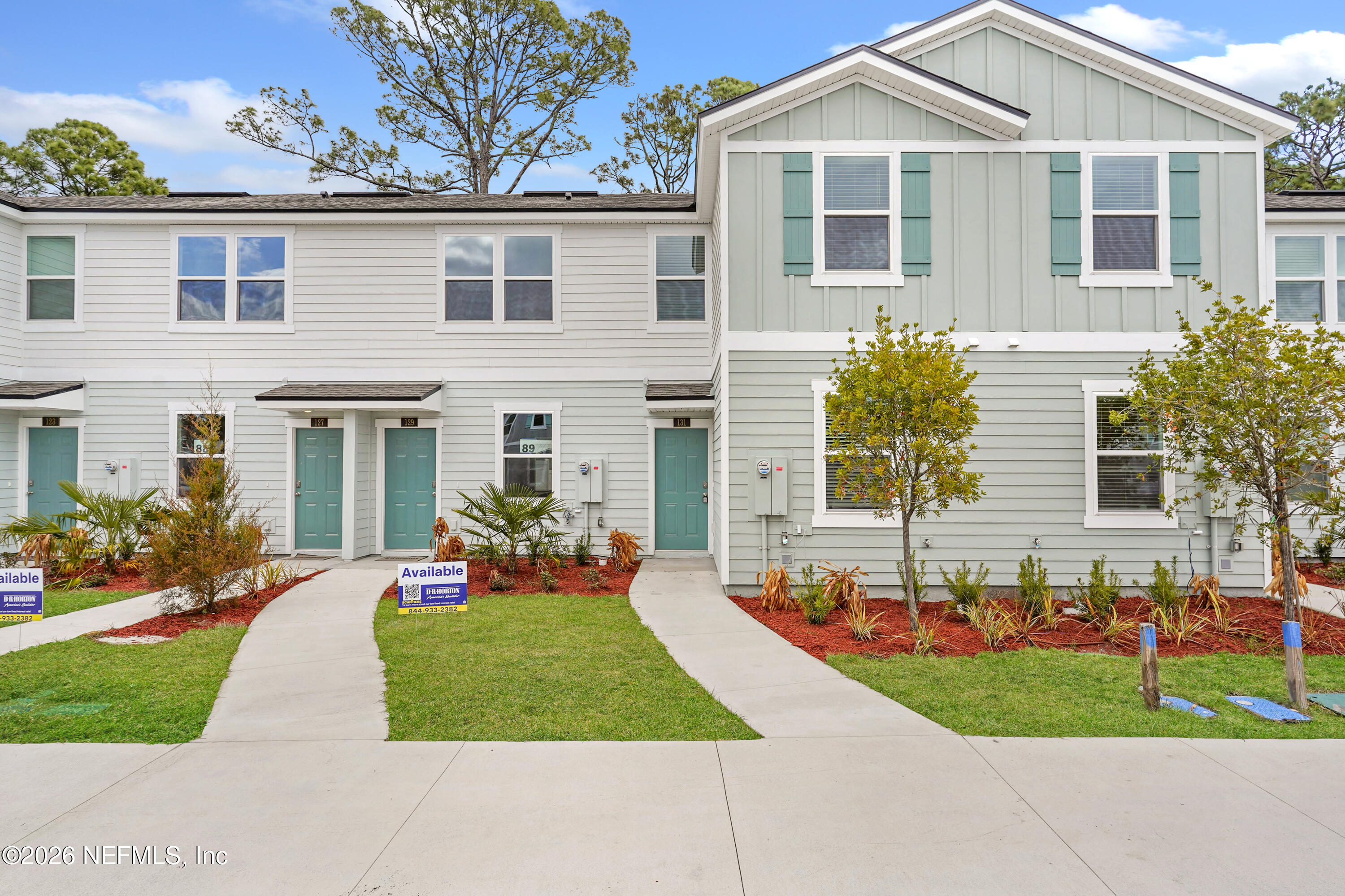 131 Palmetto Rdg Road St. Augustine, FL 32095 - Photo 1 of 26 front view of a house with a yard