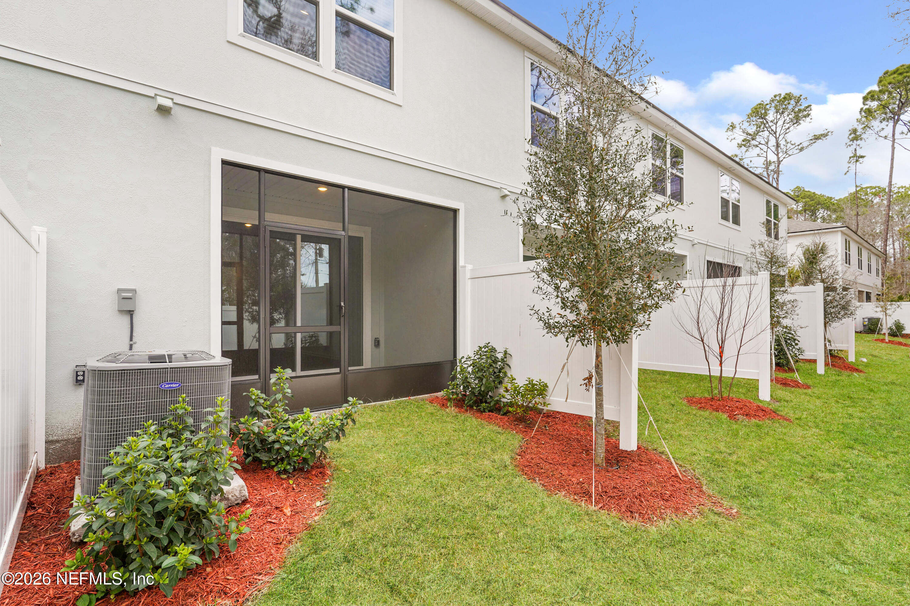 131 Palmetto Rdg Road St. Augustine, FL 32095 - Photo 21 of 26 a front view of a house with a yard