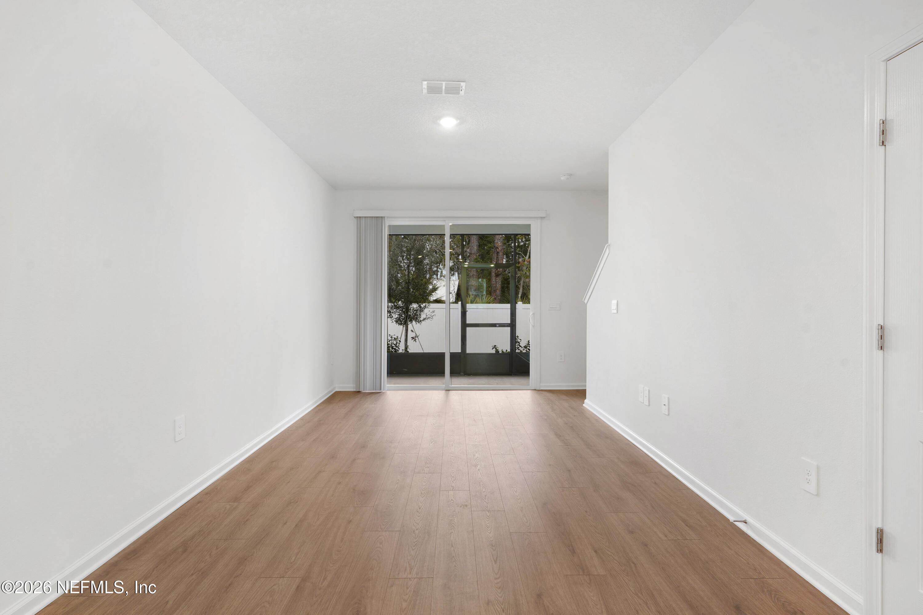 131 Palmetto Rdg Road St. Augustine, FL 32095 - Photo 6 of 26 a view of a room with wooden floor and a window