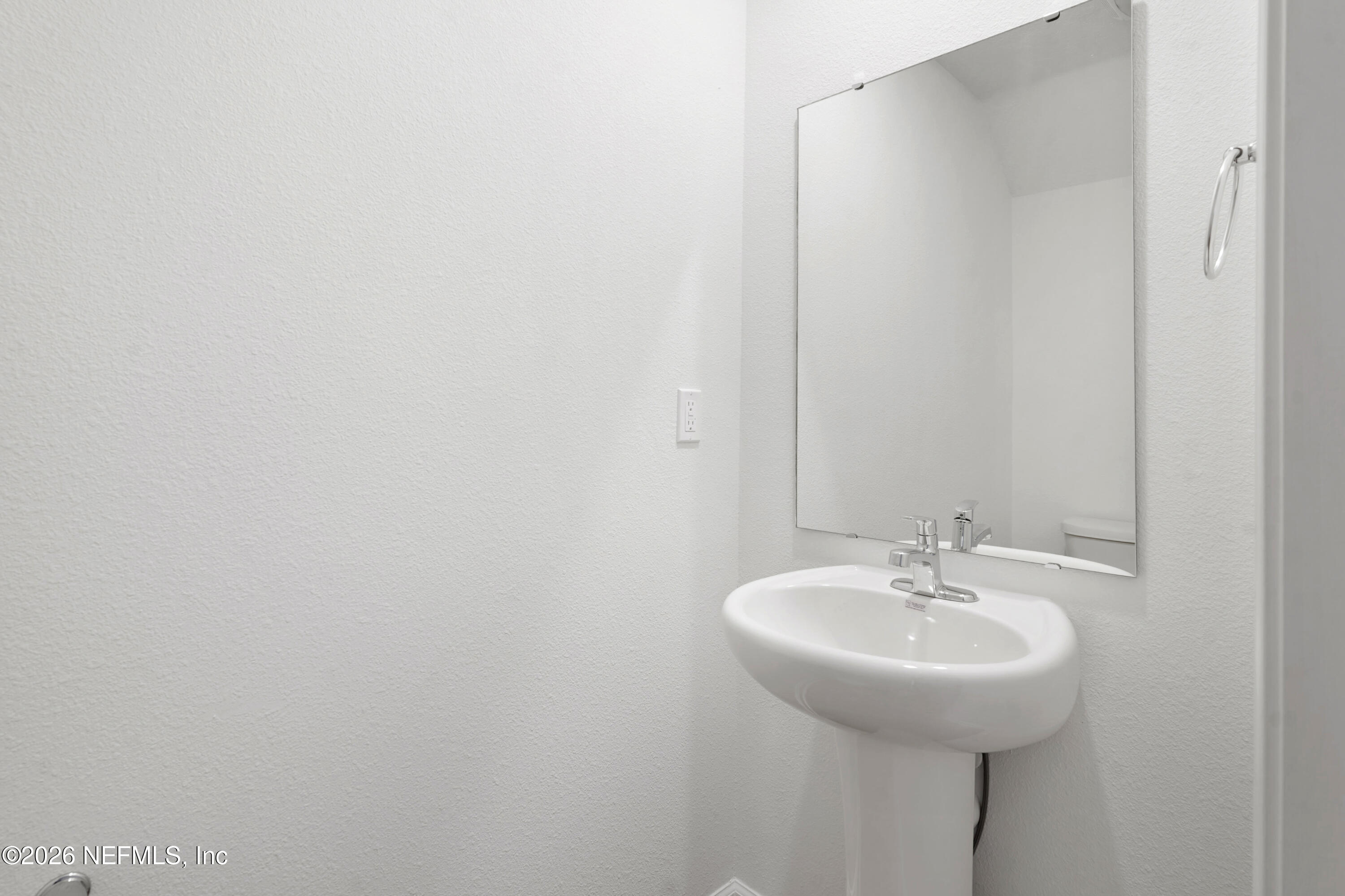 131 Palmetto Rdg Road St. Augustine, FL 32095 - Photo 10 of 26 a bathroom with a sink and a mirror