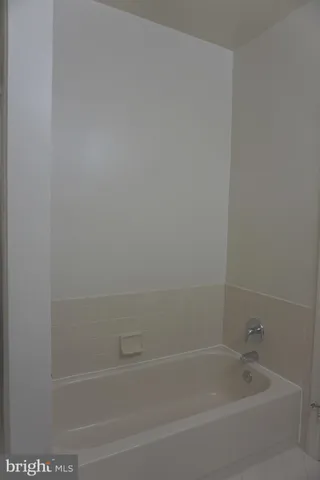 a close up of a bathtub in a bathroom