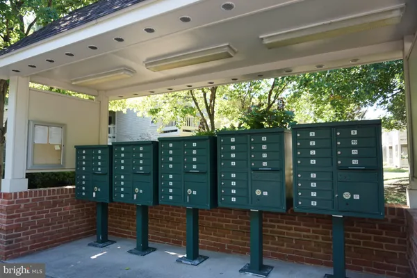 a wooden bench sitting in front of a building