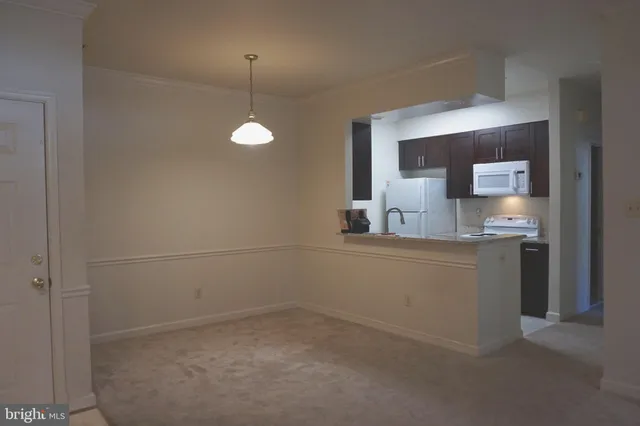 a view of a kitchen with a sink