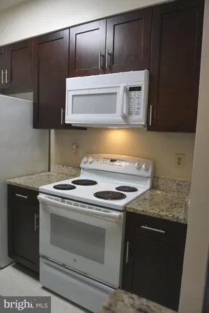 a kitchen with a stove and a microwave